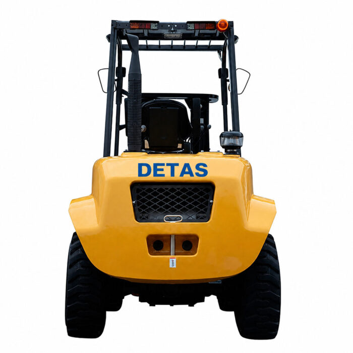 Rear view of a yellow forklift with a DETAS logo and large black tires behind a protective cage?edge guard.