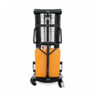 Electric pallet stacker with orange battery pack, black lifting frame, and forks at the base (capacity label shows 1500 kg).