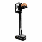 Industrial vertical lift with a robot base labeled DETAS carrying a cardboard box on a raised platform (warehouse order picker)