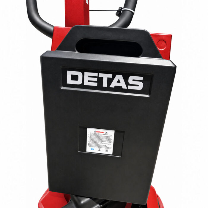 transpallet-elettrico-DETASN-15q-02 Close-up of a black DETAS control unit attached to a red industrial machine handle.