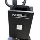 Close-up of a black Noble-brand control housing on a fitness machine, with a small label slot and curved handlebars visible above.