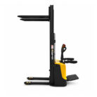 Electric pallet stacker with black mast and yellow base, showing fork tines extended forward for loading pallets.