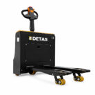 Detas pallet jack with black body, yellow accents, and long forks for lifting pallets.