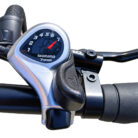 Close-up of a Shimano 7-speed bike gear shifter and handlebar grip on a bicycle.