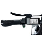 Close-up of a motorcycle handlebar with grip and brake lever, featuring a digital display showing speed, mileage, and trip data