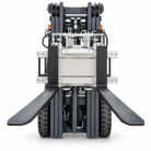 Front view of a forklift with extended black forks and a heavy-duty mast ready to lift pallets.
