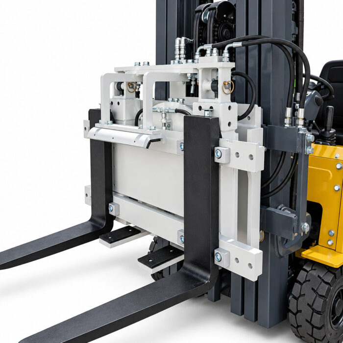 Close-up of forklift forks and hydraulic carriage assembly ready to lift pallets, showing metal frame and hoses.